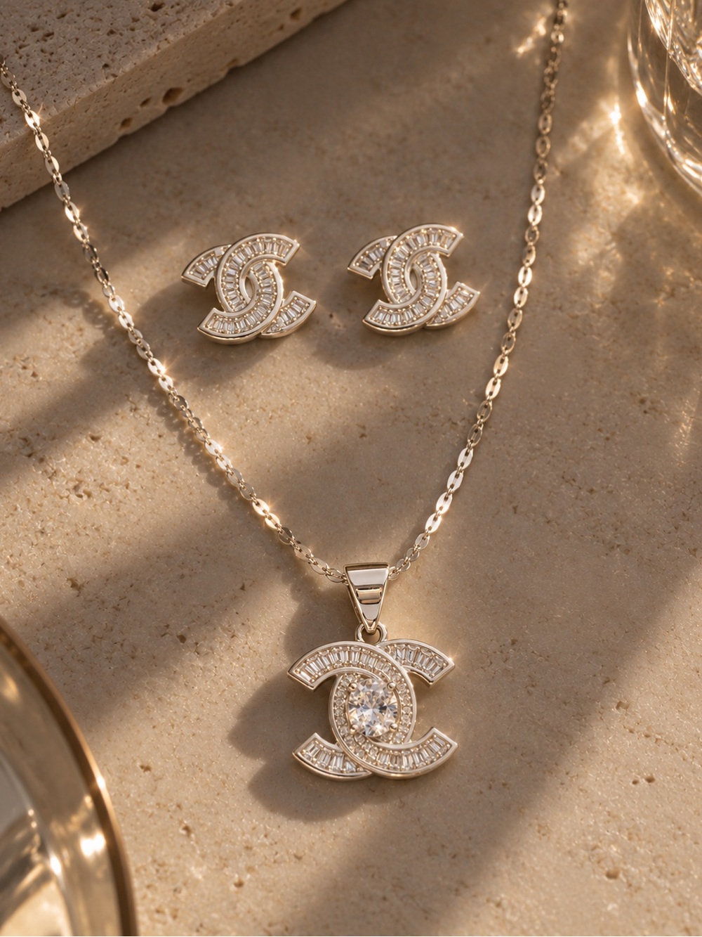 Gold Crystal Interlocking Logo Pendant Necklace and Stud Earring Set